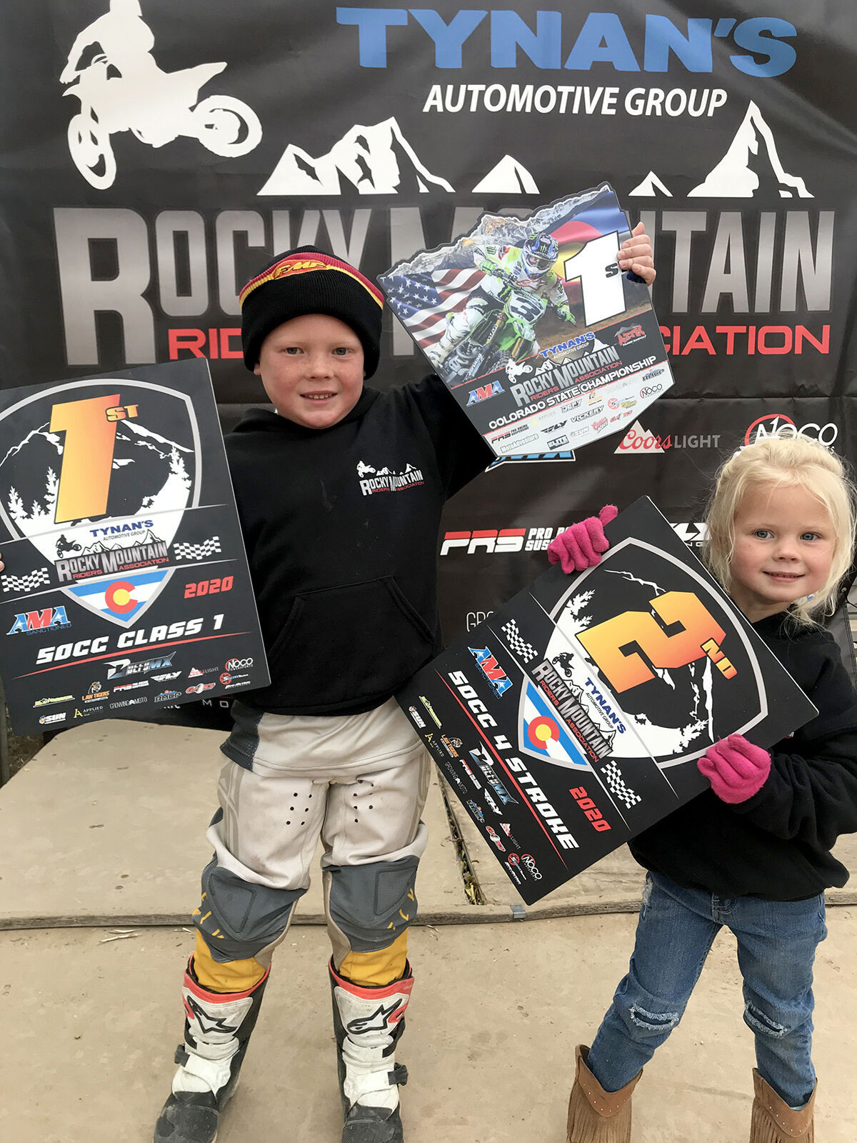 Noah Luke trophies with sister